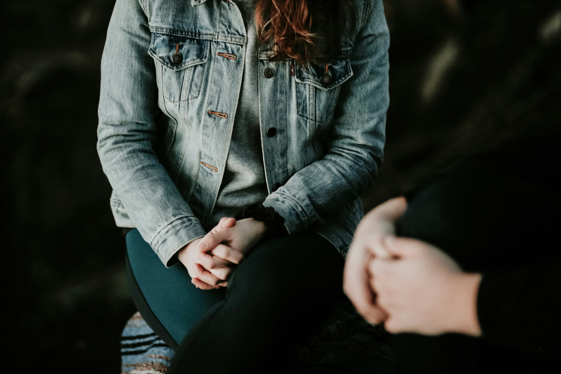 A woman sitting cross legged